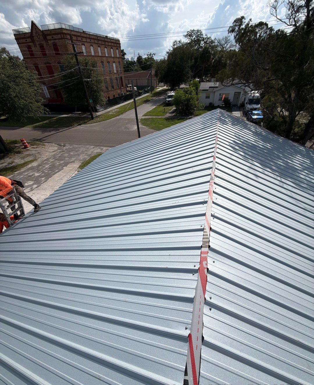 Aerial view of a standing seam metal roof installation in Tampa FL by Protek Roofing