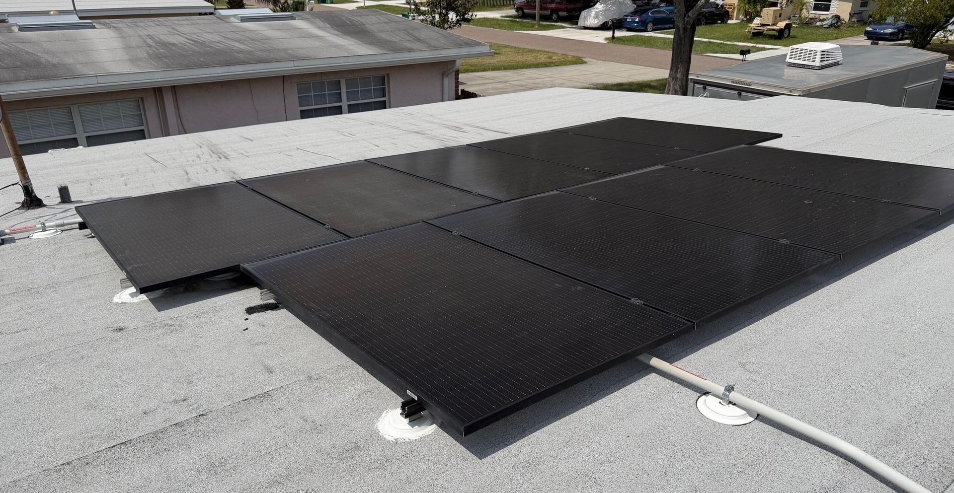 Solar array on a low-slope roof in Clearwater FL โ roof work by Protek Roofing & Solar