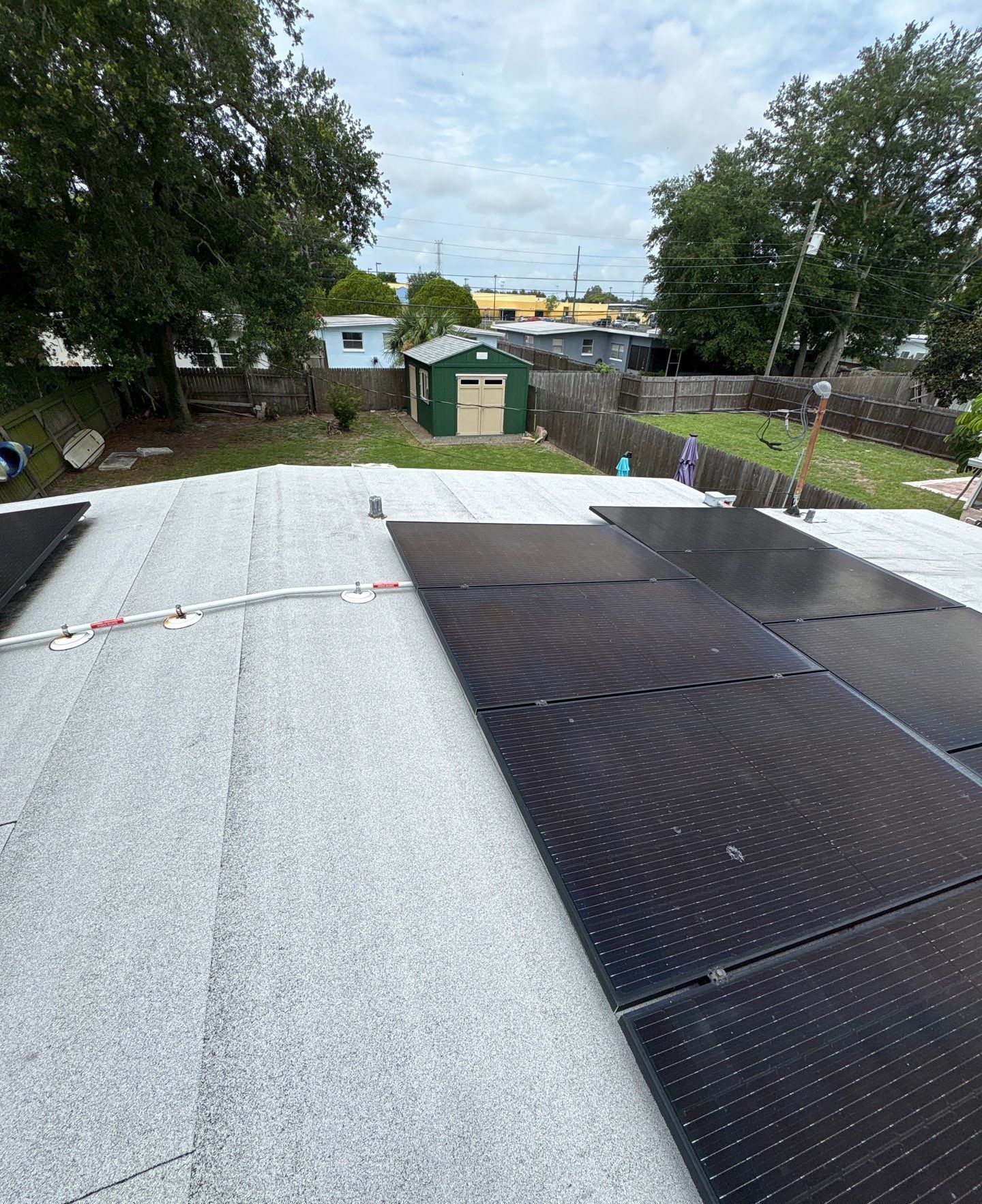 Solar panels along a Clearwater FL roofline โ roof work by Protek Roofing & Solar