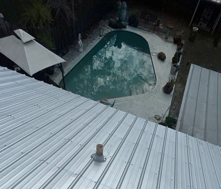 Galvalume metal roof over the pool side of a South Tampa home