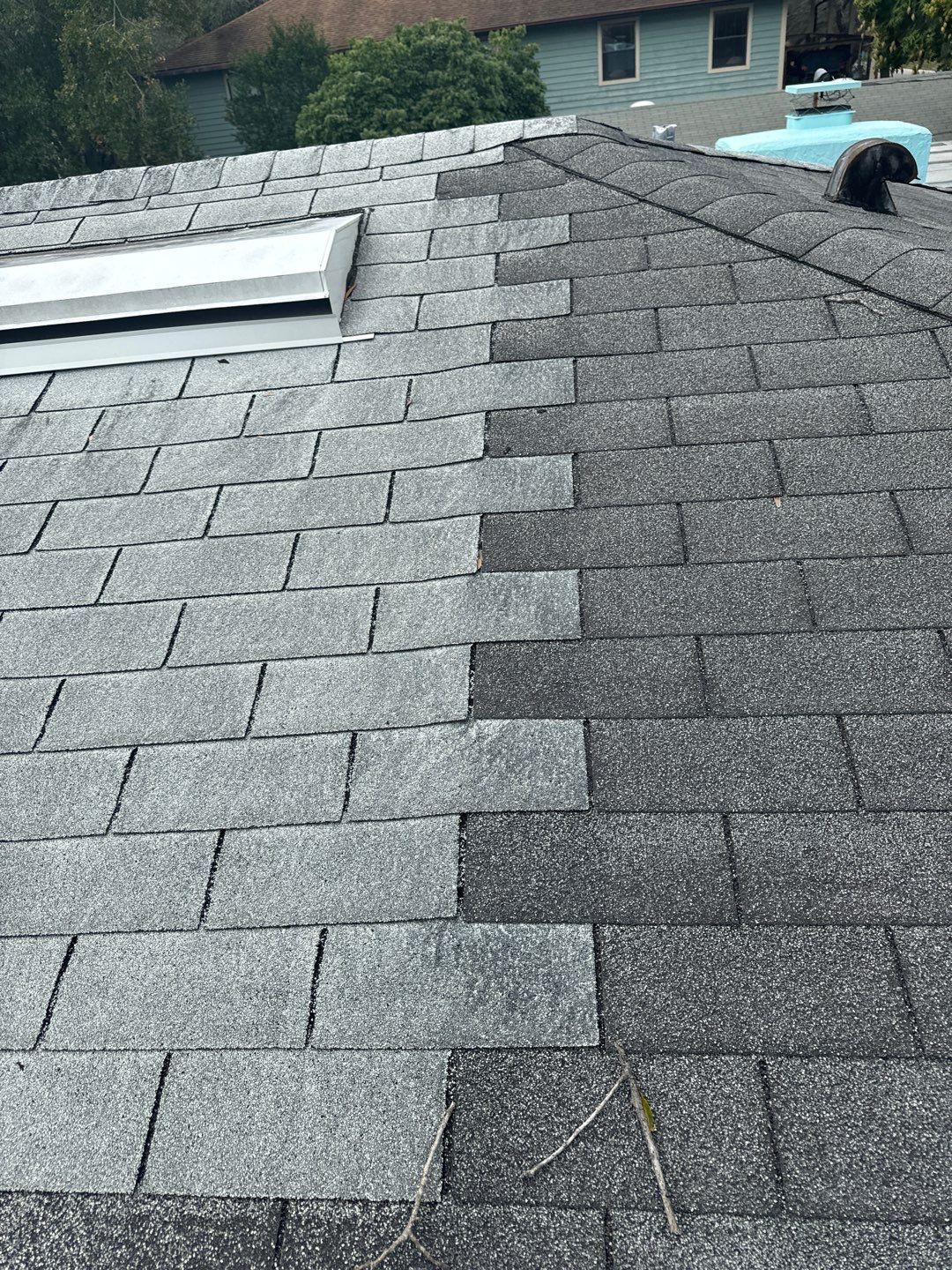 Worn shingle roof with mismatched patch repairs in South Tampa