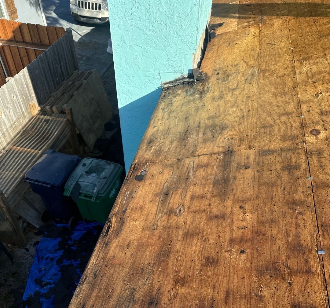 Old roof decking exposed during tear-off in South Tampa