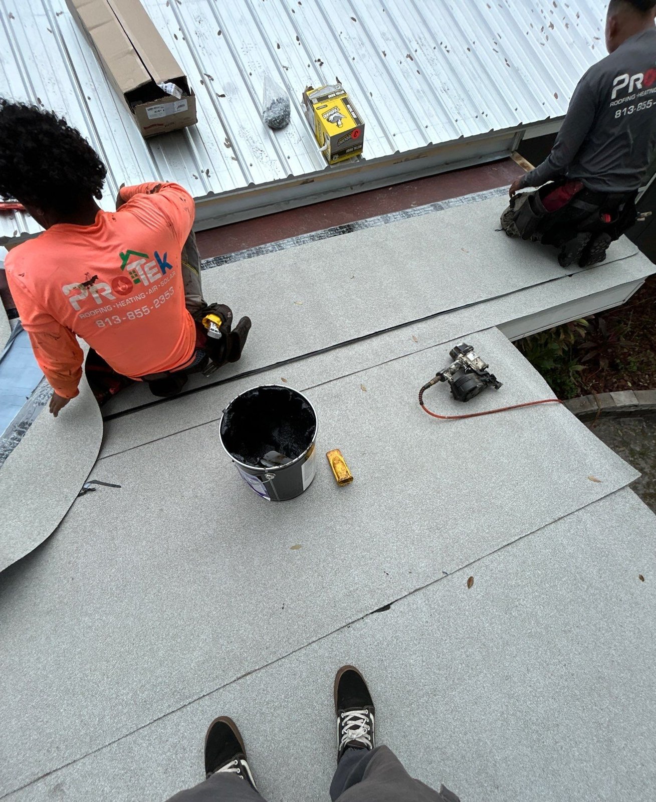 Finished metal roof and new flat section viewed from the ridge in Tampa FL