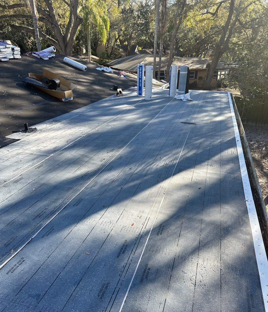 Base layer going down on the low slope roof section