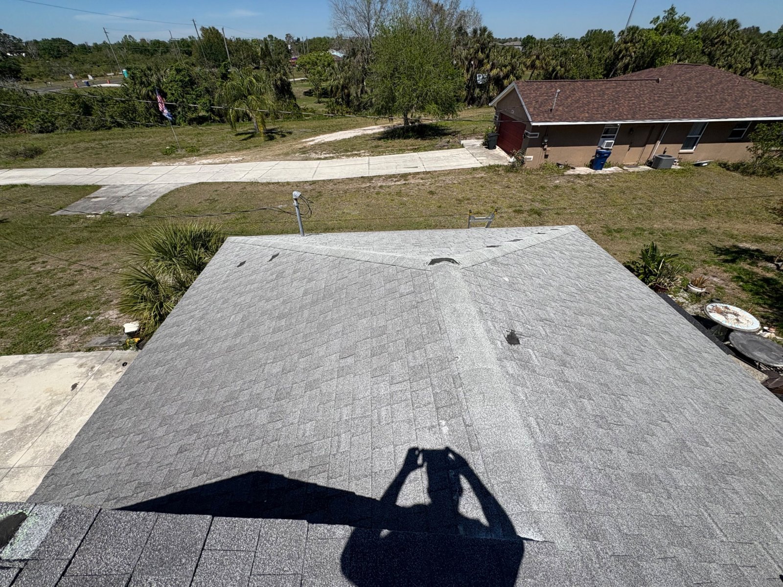 Aged shingle roof ridge and valleys before replacement in Palmetto FL