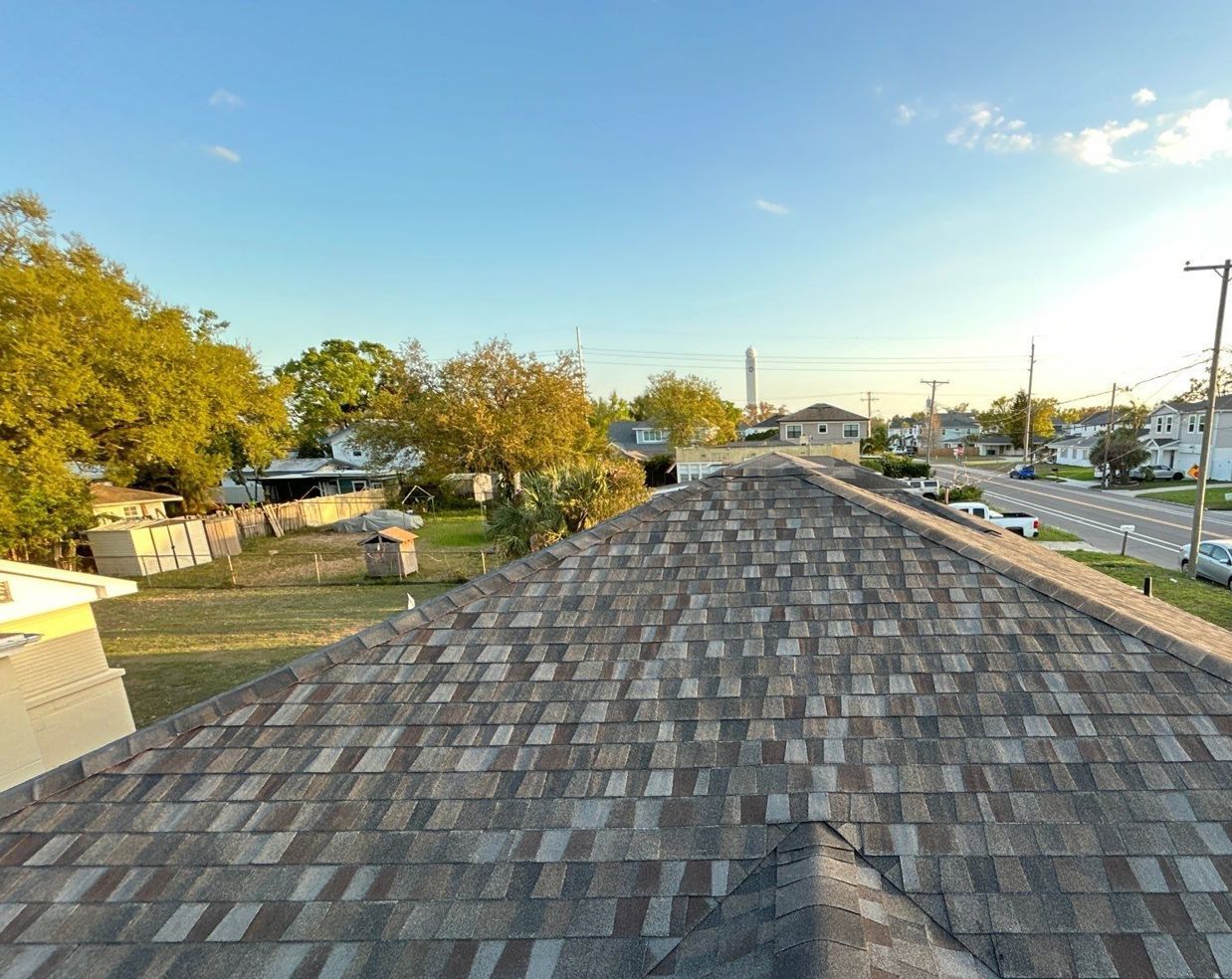 Finished architectural shingle roof and ridge line after replacement in Tampa FL