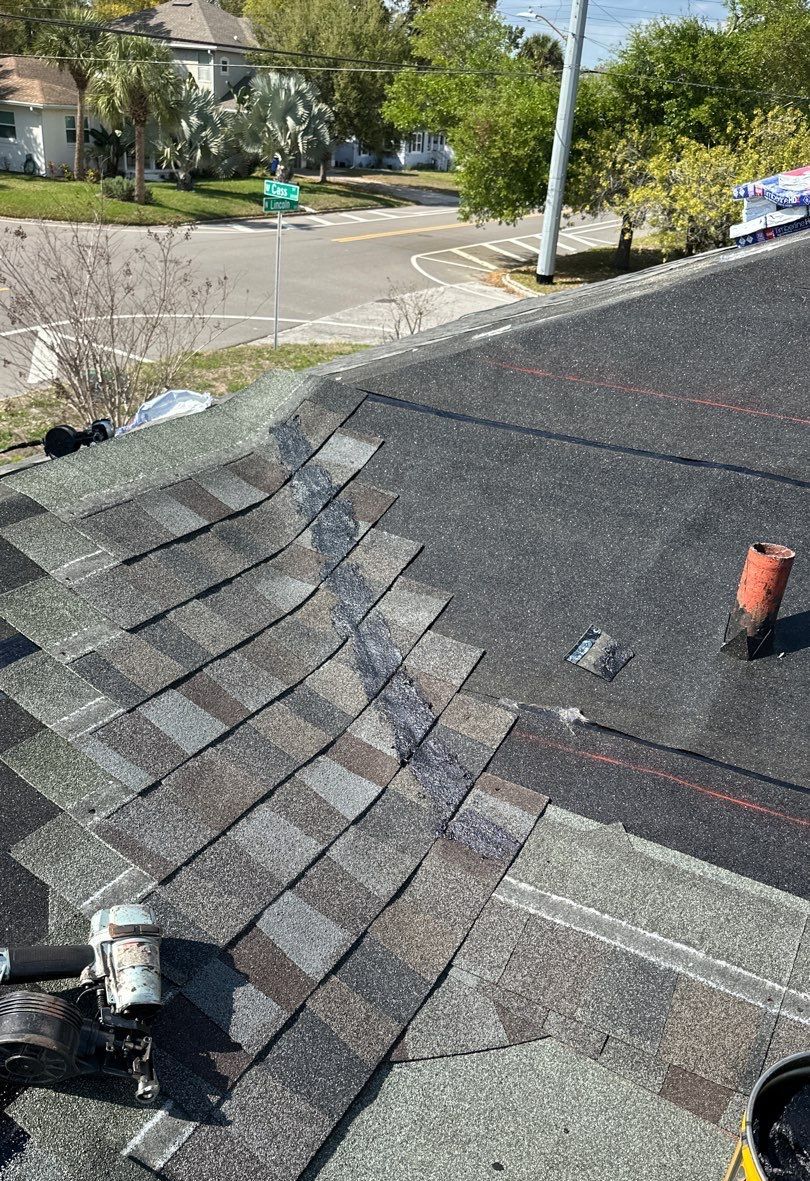 New architectural shingles being installed over underlayment during a roof replacement in Tampa FL