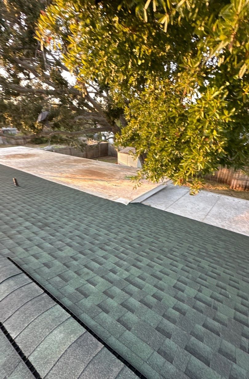 New shingle slopes tied into a low-slope roof section in St. Petersburg FL